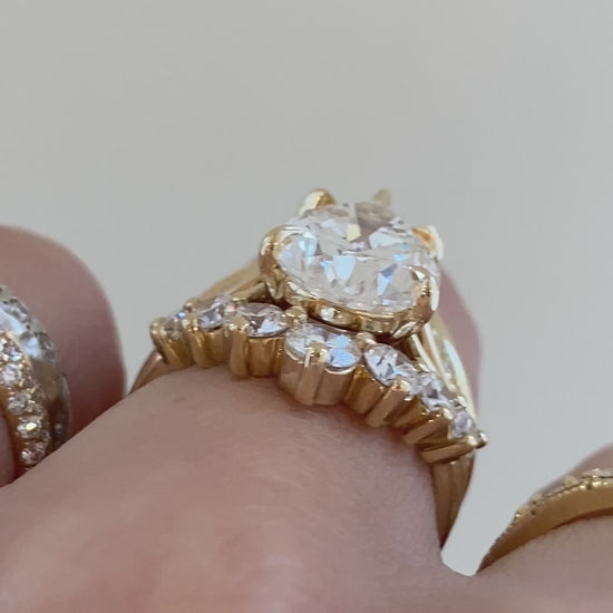 caption:Shown with 4ct pear, stacked with Kiana, Alexia and Antoinette Large