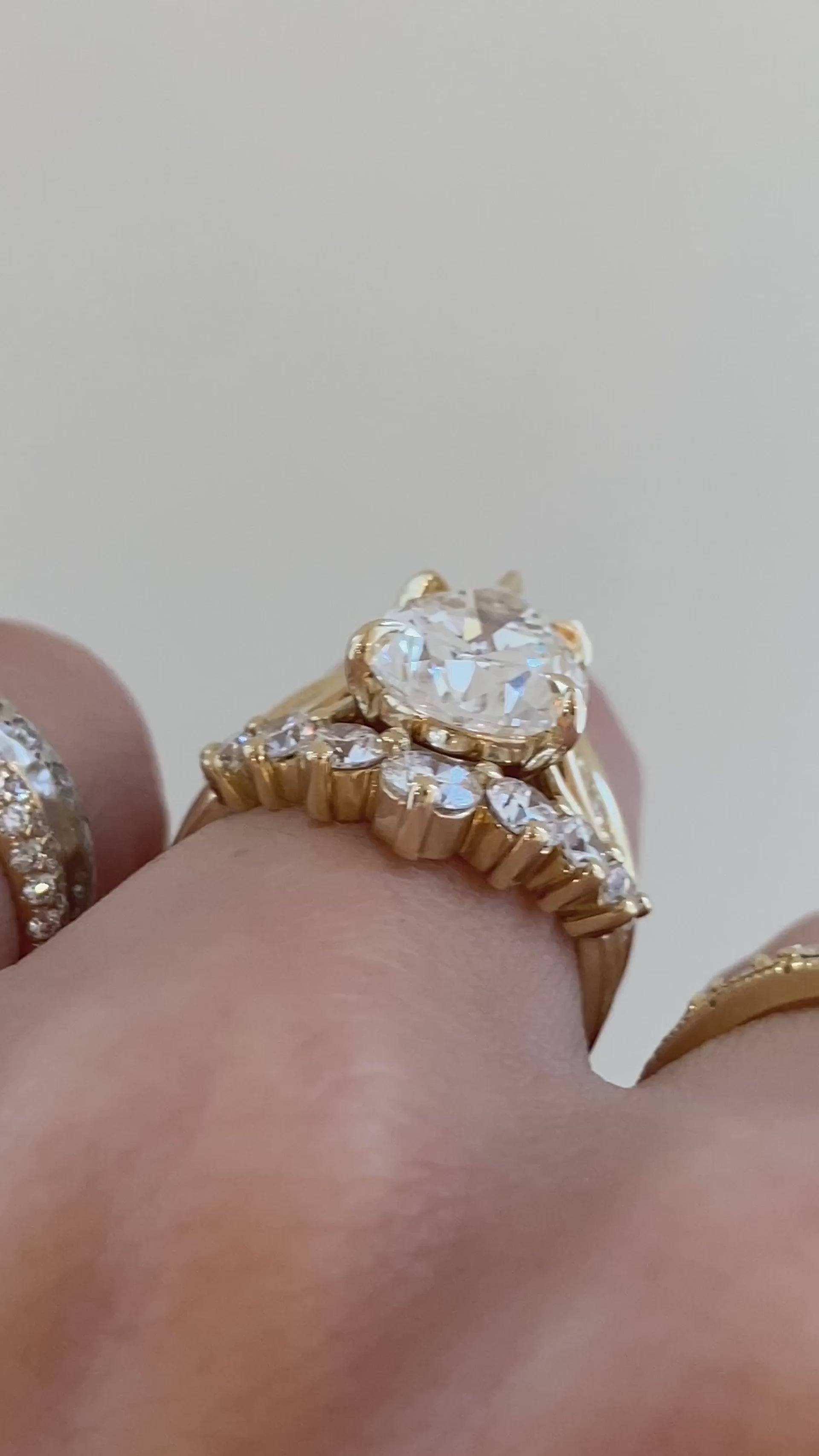 caption:Shown with 4ct pear, stacked with Kiana, Alexia and Antoinette Large