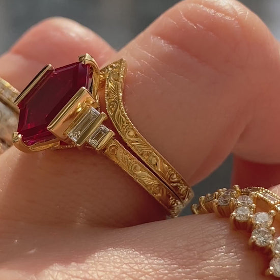 caption:Shown stacked with Decca 2.5ct ruby in 18k yellow gold 