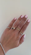 caption:Shown with 0.70ct white & grey pear diamonds in 18k yellow gold