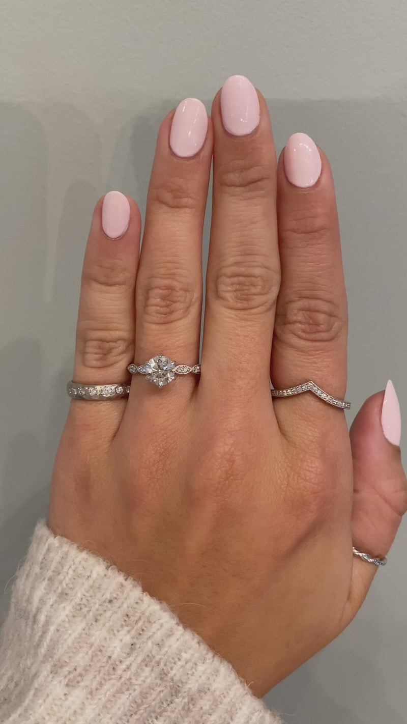 caption:Custom Naldis shown with 1.2ct round diamond in platinum