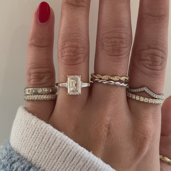 caption:Shown with 2.5ct emerald cut in 14k yellow
