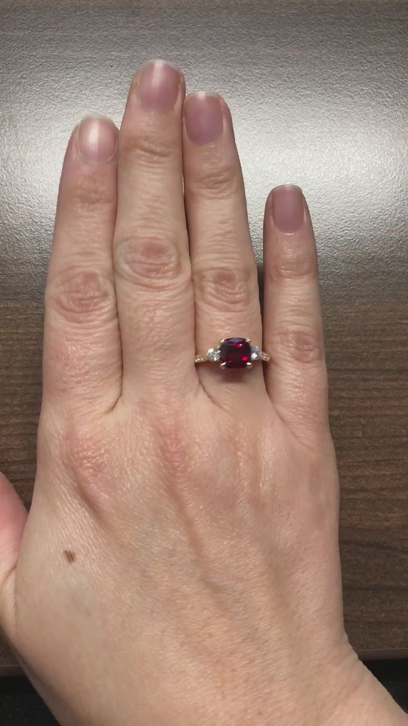 caption:Shown with 2ct cushion cut ruby in 14k yellow gold
