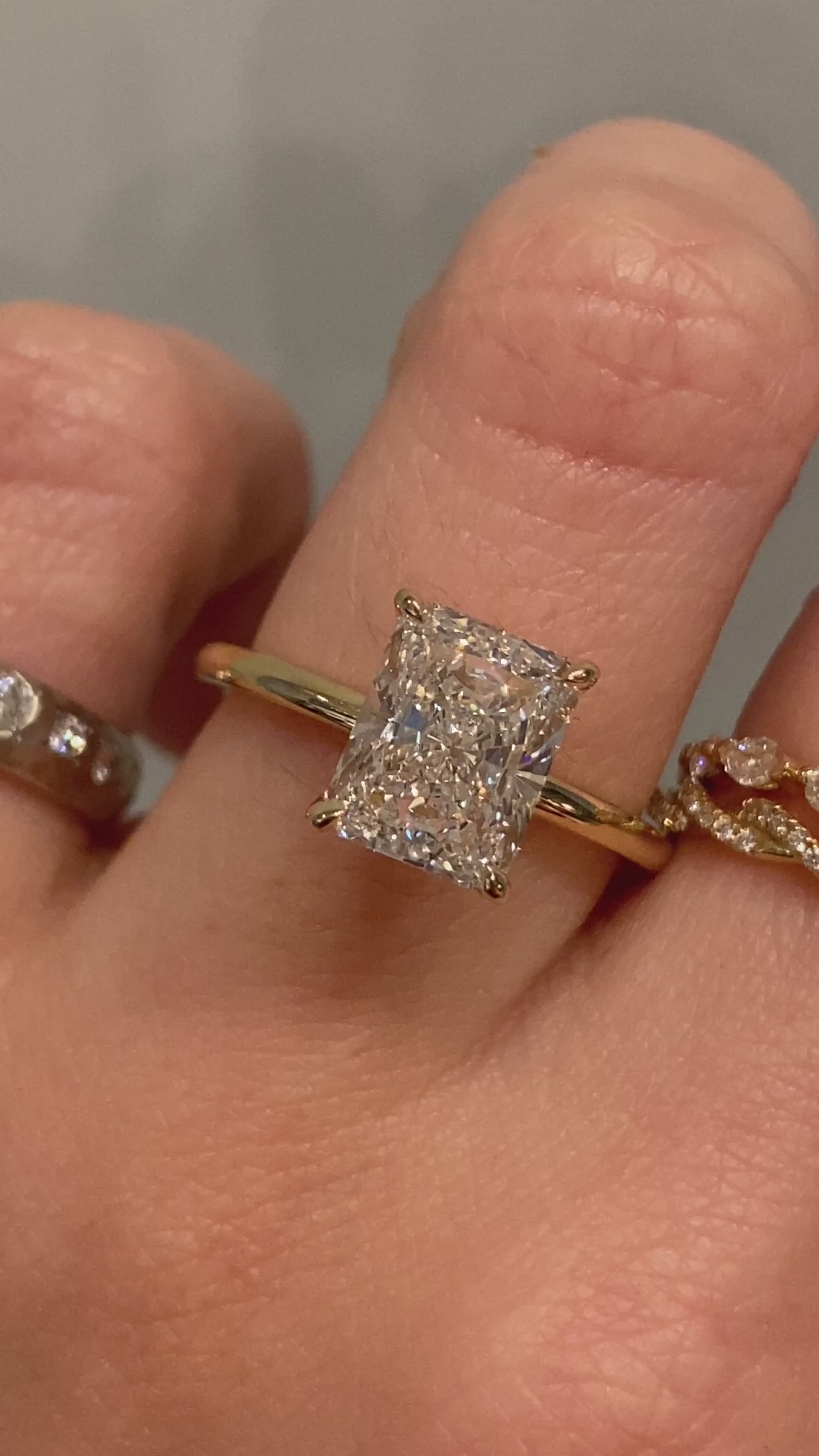 caption:Shown with radiant cut diamond set in yellow gold