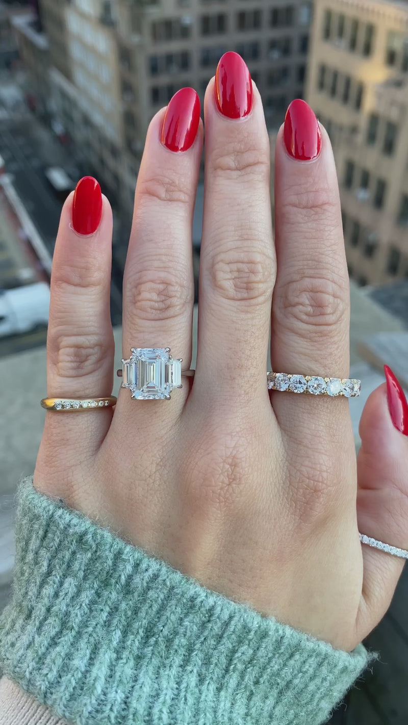 caption:Shown with 4.5ct emerald cut diamond in platinum