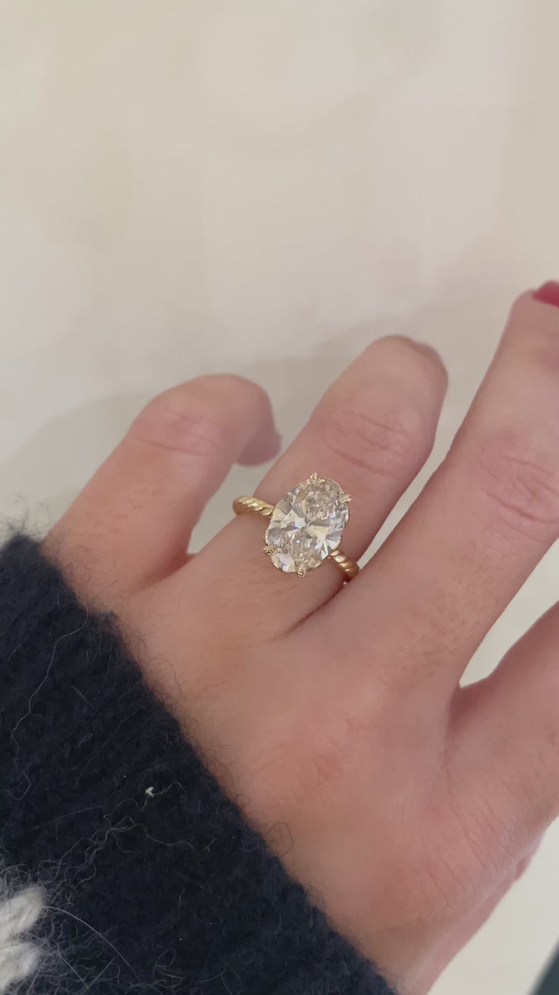 caption:Shown with 3ct oval in 14k yellow gold