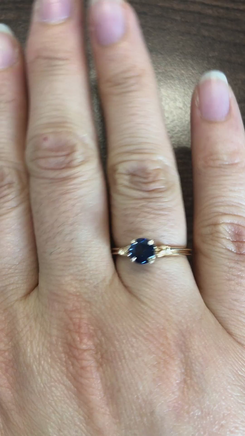 caption:Shown with round blue sapphire in 14k yellow gold