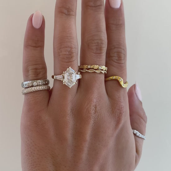 caption:Shown with 3ct elongated hexagon in 14k yellow gold 