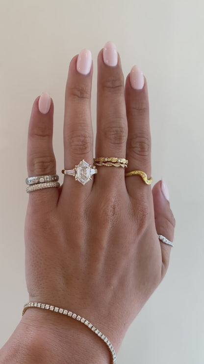 caption:Shown with 3ct elongated hexagon in 14k yellow gold 
