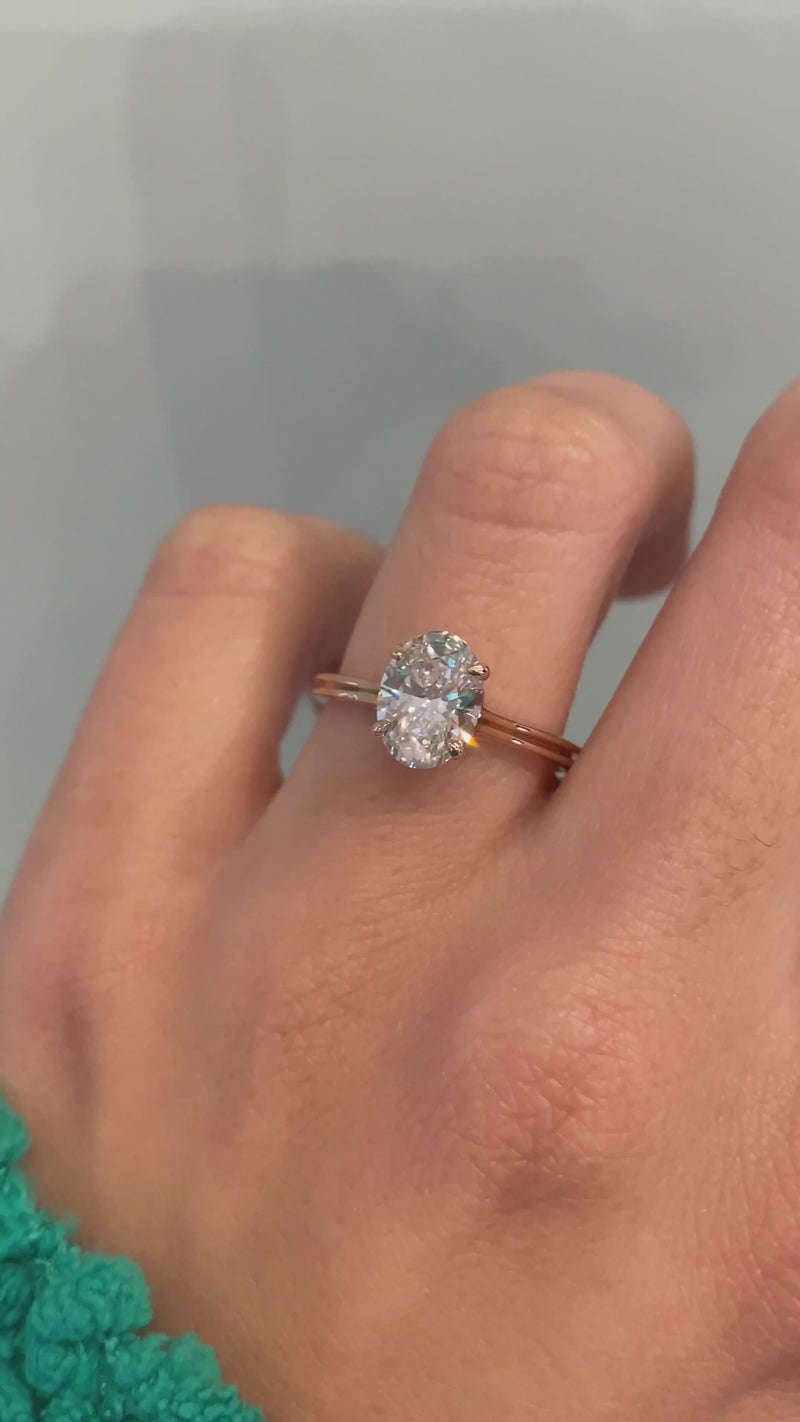 caption:Shown in 14k rose gold with 1.2ct oval diamond