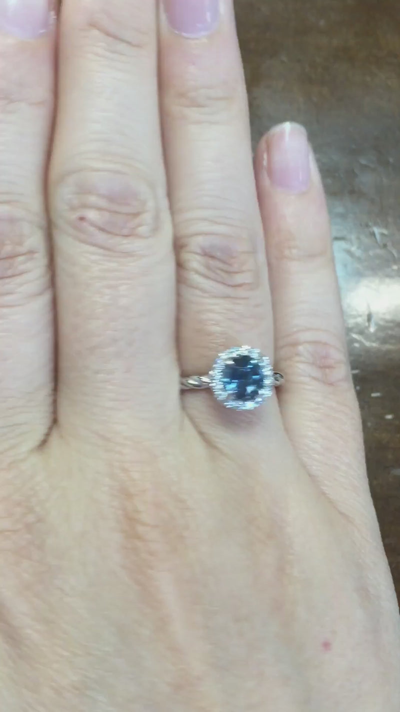 caption:Shown with round blue sapphire in platinum