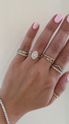 caption: Shown with 2.5ct oval diamond in 14k rose gold
