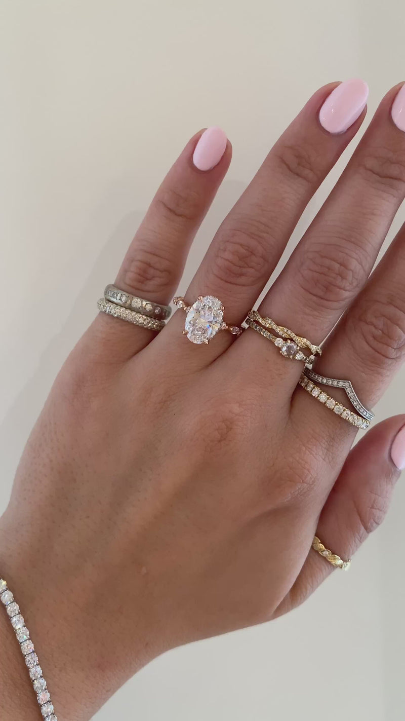 caption: Shown with 2.5ct oval diamond in 14k rose gold
