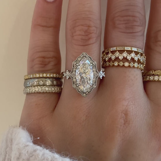 caption:Shown with 3ct marquise in platinum