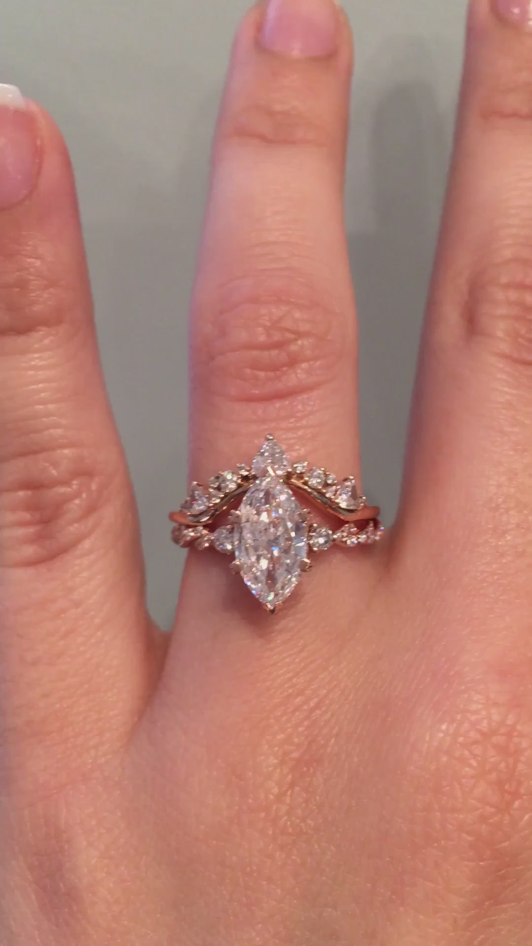 caption:Shown with marquise cut diamond paired with Tempest wedding band