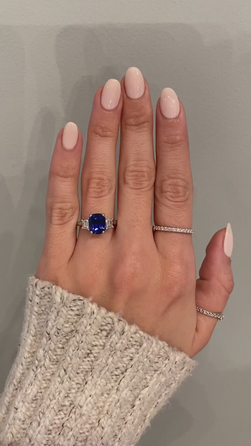 caption:Shown with cushion cut blue sapphire in platinum