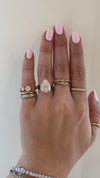 caption:Shown with 4.2ct pear diamond in yellow gold