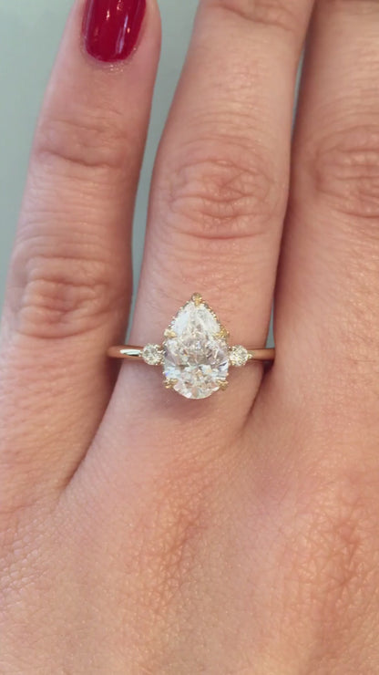 Shown with 1.5ct pear diamond set in 14k yellow gold