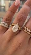 caption:Stacked with Matilda engagement ring with 2.5ct oval diamond in 18k yellow gold