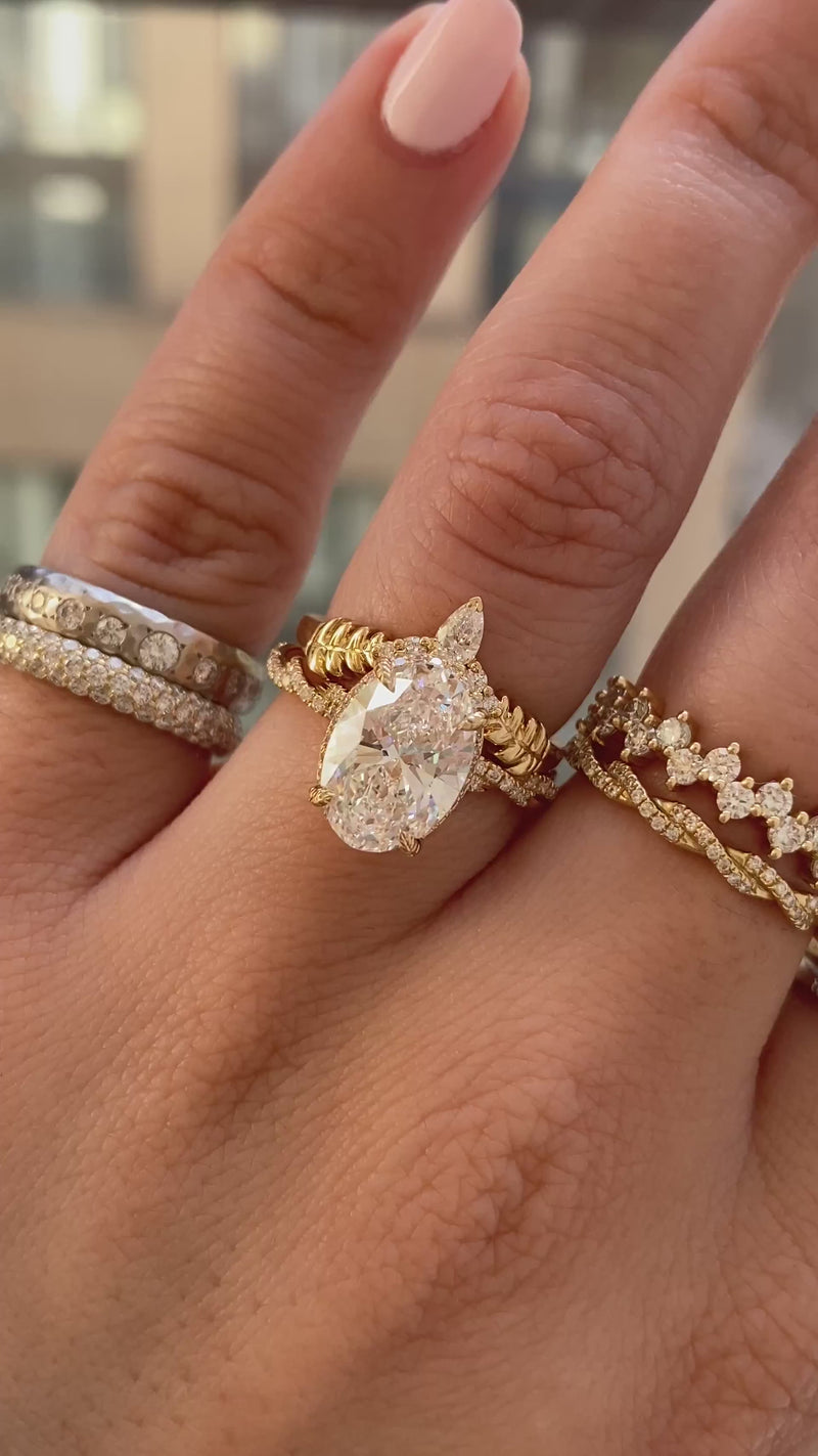 caption:Stacked with Matilda engagement ring with 2.5ct oval diamond in 18k yellow gold