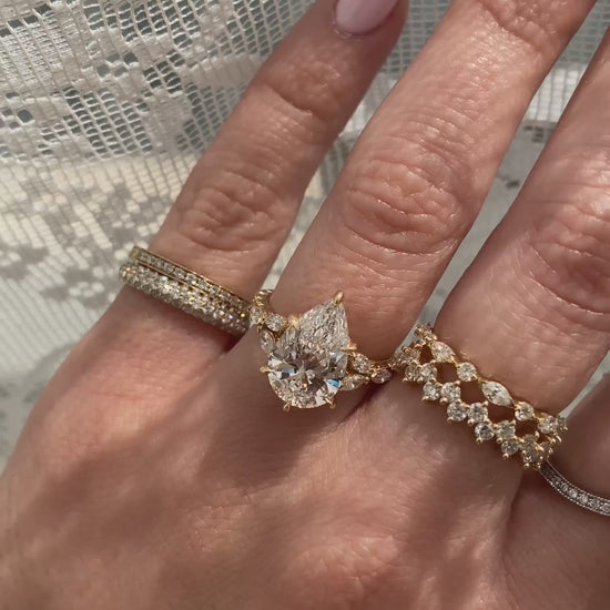 caption:Shown with 3ct pear in 18k yellow gold