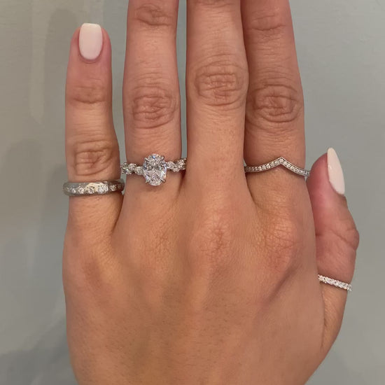 caption:Shown with 1.3ct oval diamond in platinum