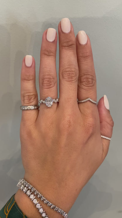 caption:Shown with 1.3ct oval diamond in platinum