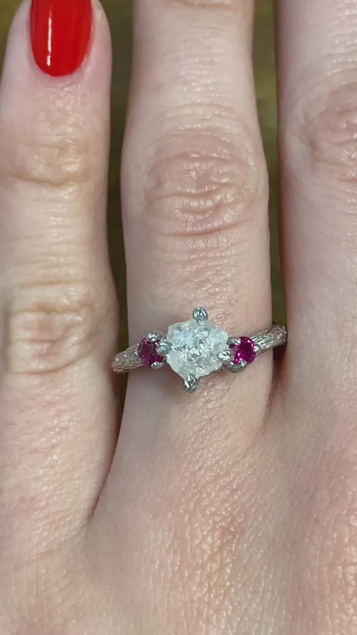 caption:Shown with rough cut diamond & ruby side stones in platinum