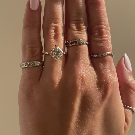 caption:Shown with 2.5ct princess cut in 14k yellow gold 