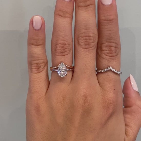 caption:Shown with Florina - Pear engagement ring