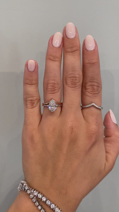 caption:Shown with Florina - Pear engagement ring