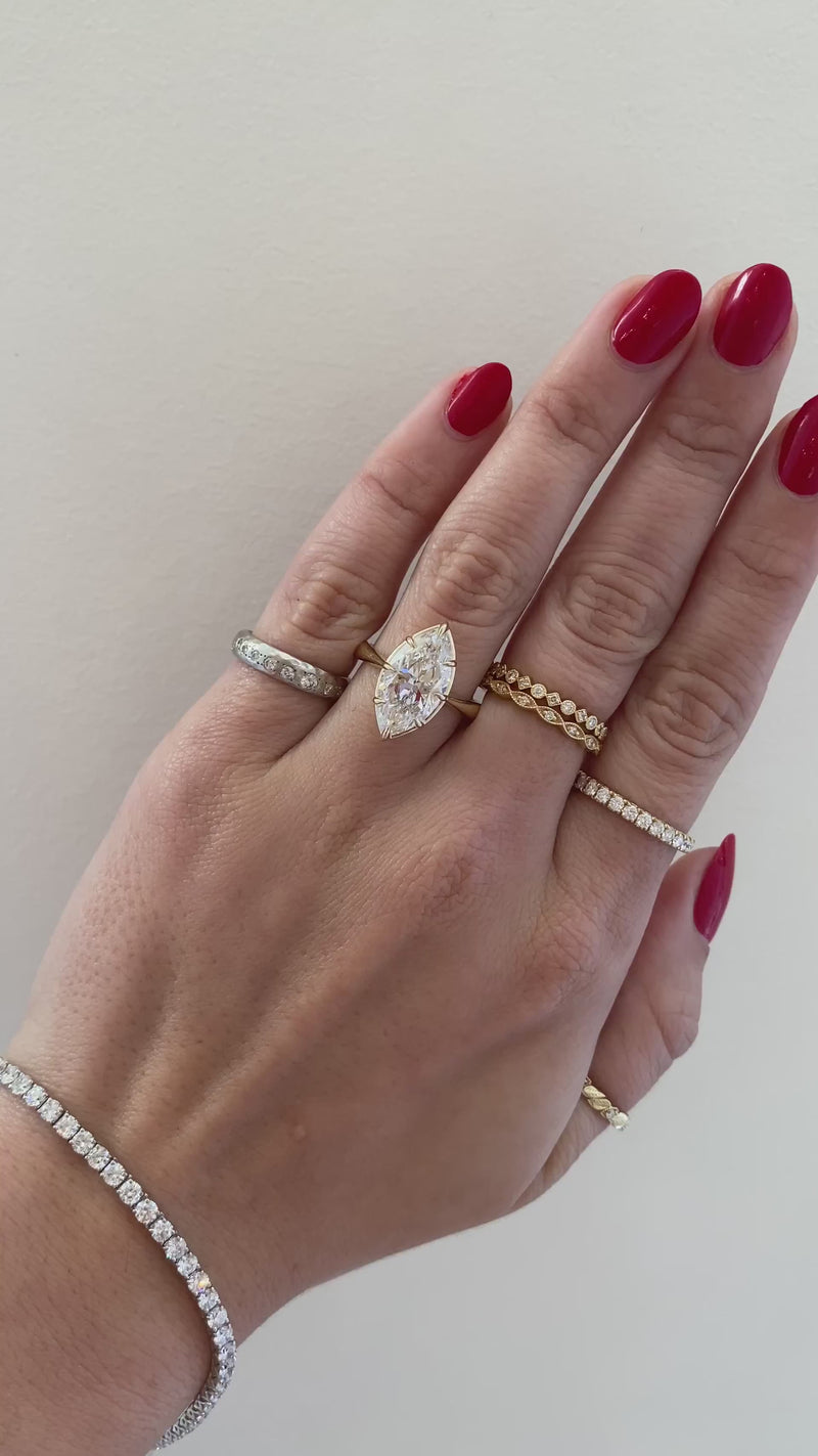 caption:Shown with 4ct marquise diamond in 14k yellow gold