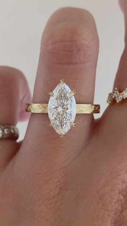 caption:Shown with 2ct marquise in 14k yellow gold 