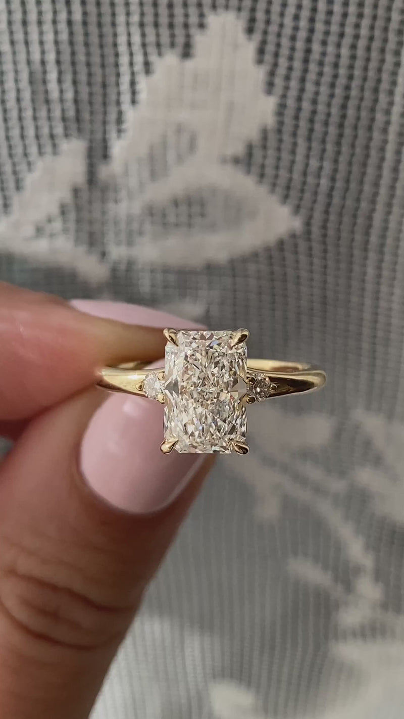caption:Shown with 2ct radiant cut diamond in 14k yellow gold 