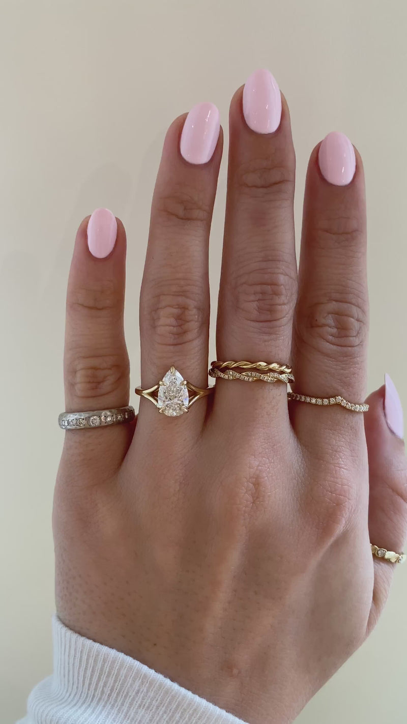 caption:Shown with 1.7ct pear diamond in 14k yellow gold, customized with leaf prongs