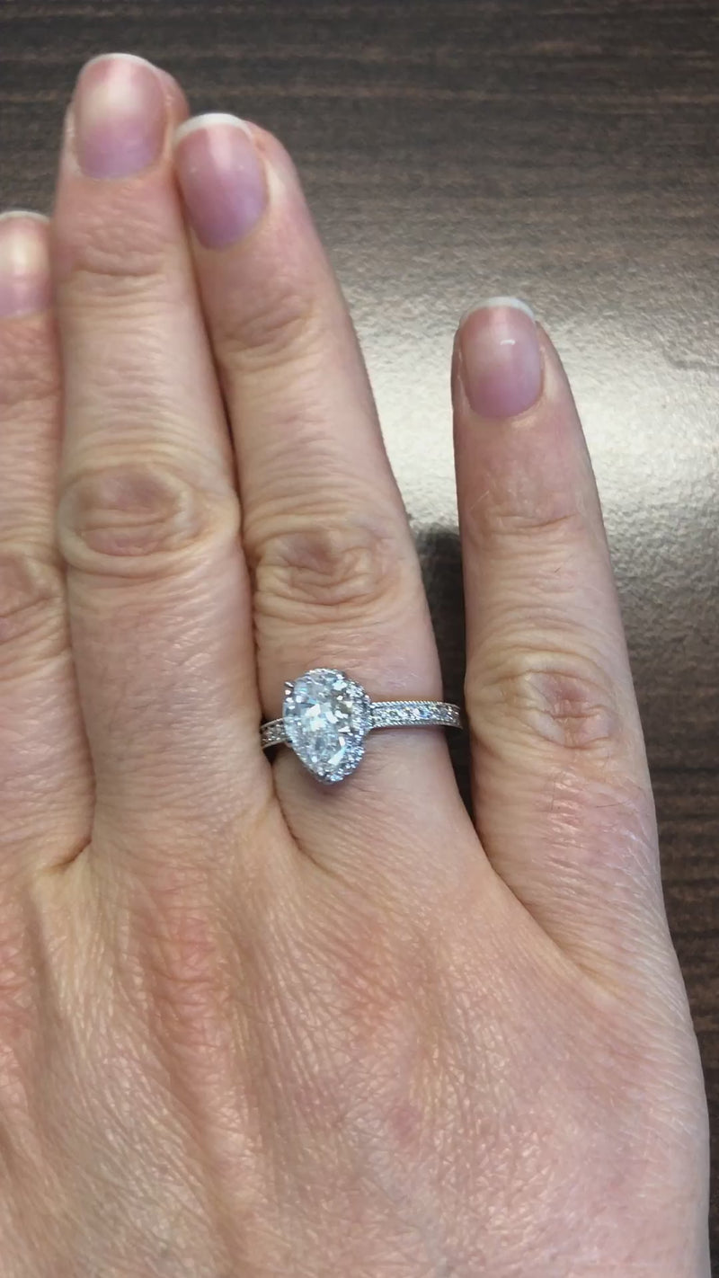 caption:Shown with pear diamond in platinum