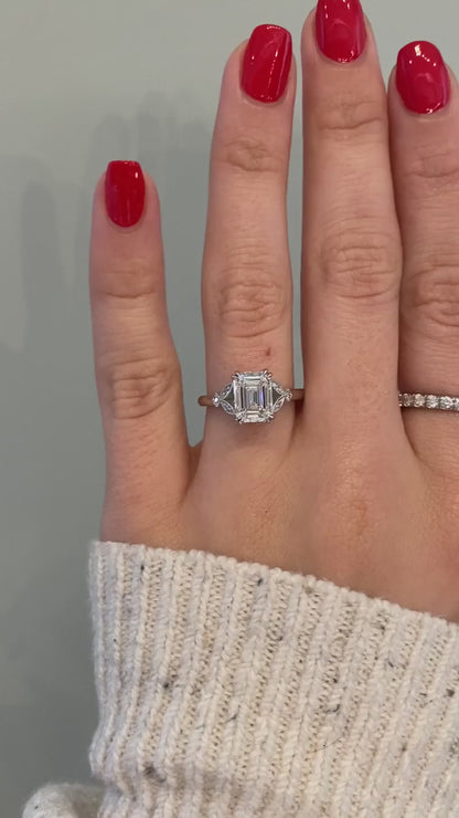 caption:Shown with a 2ct emerald cut diamond