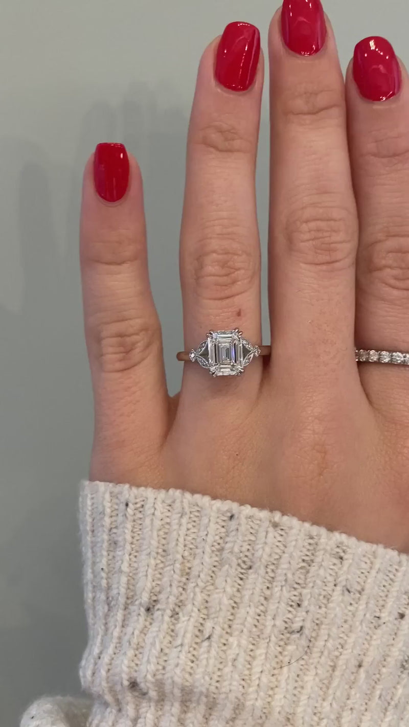 caption:Shown with a 2ct emerald cut diamond in platinum