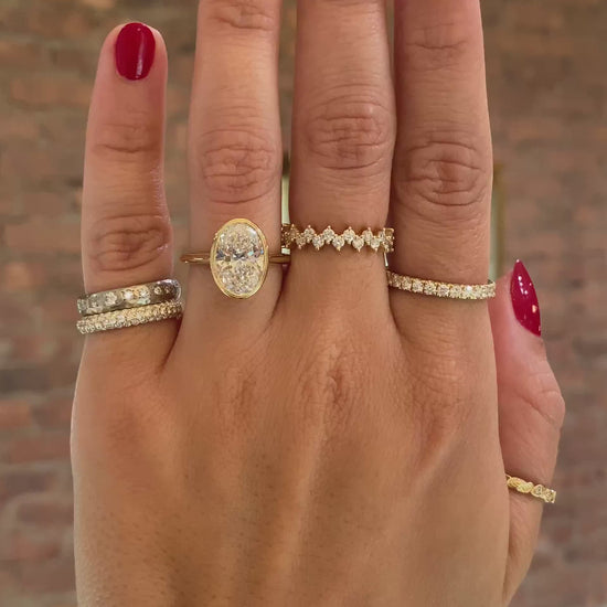 caption:Shown with 3ct oval in 14k yellow gold 