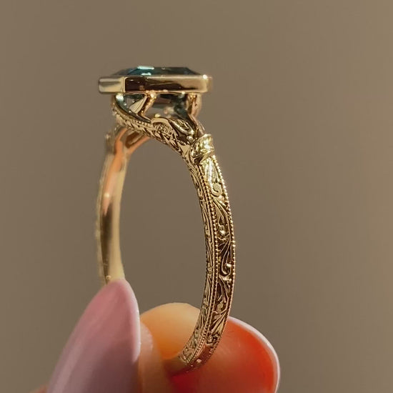 caption:Shown with 1.5ct emerald cut sapphire in 18k yellow gold 