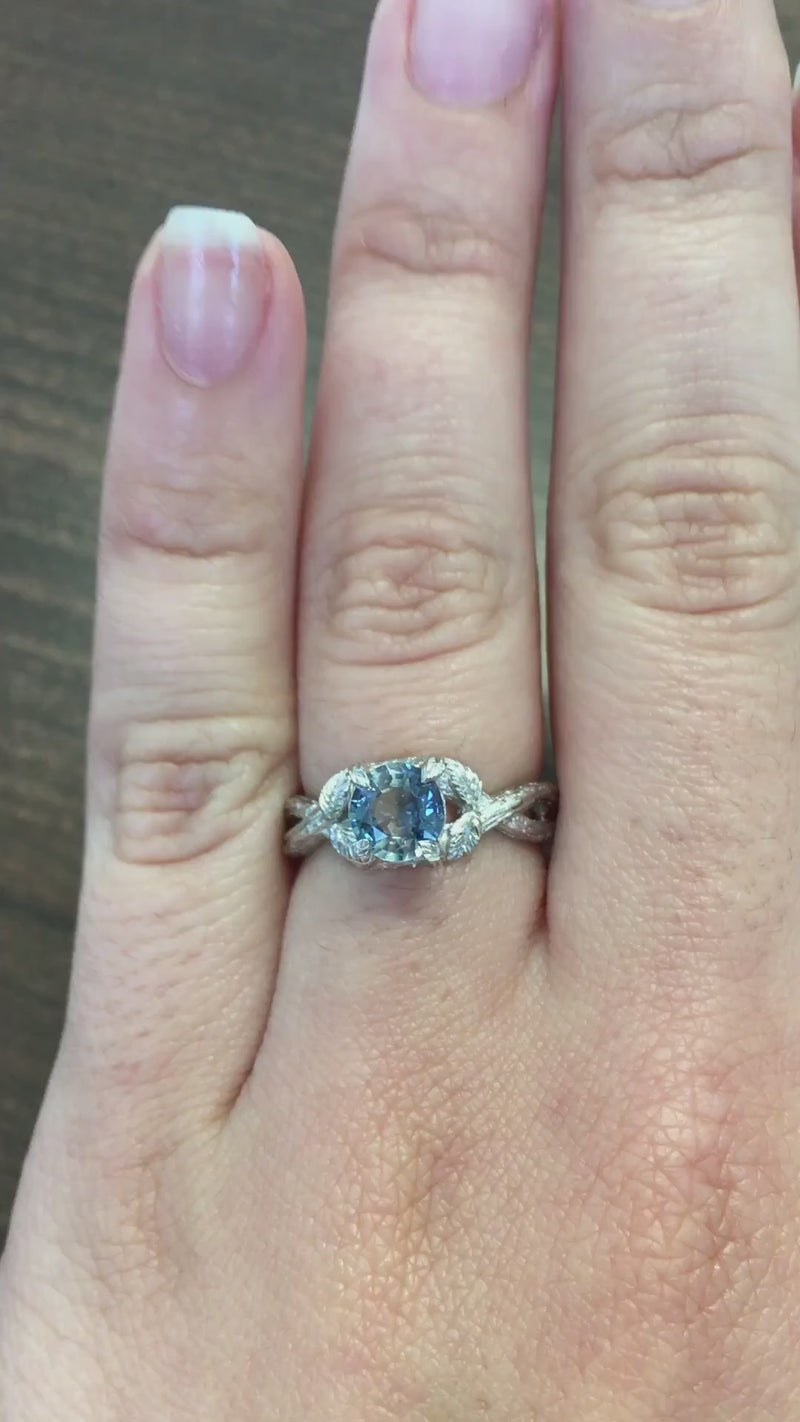 caption:Shown with round blue sapphire in platinum