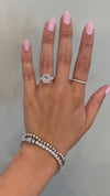 caption:Shown with cushion cut diamond in platinum
