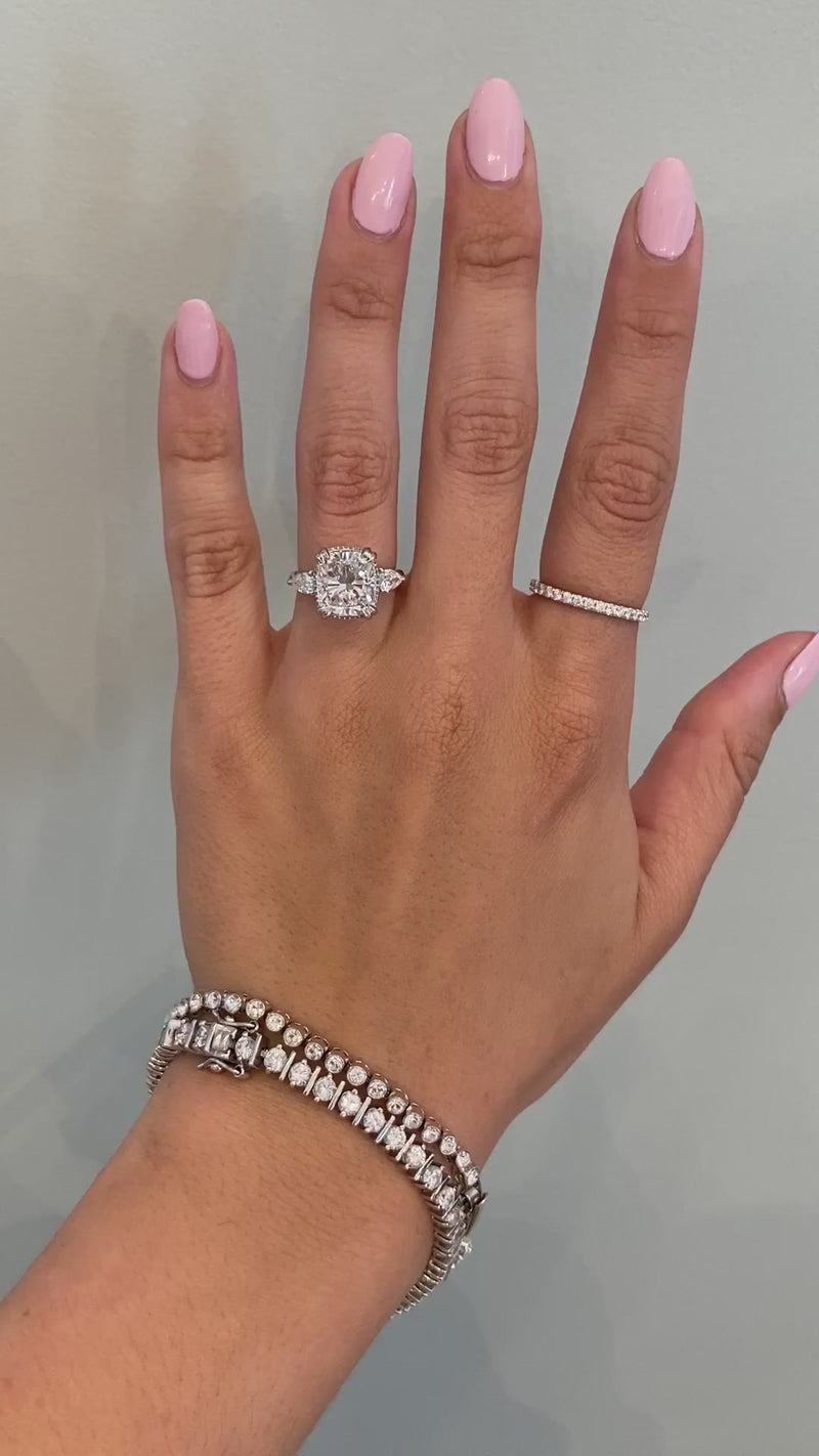 caption:Shown with cushion cut diamond in platinum