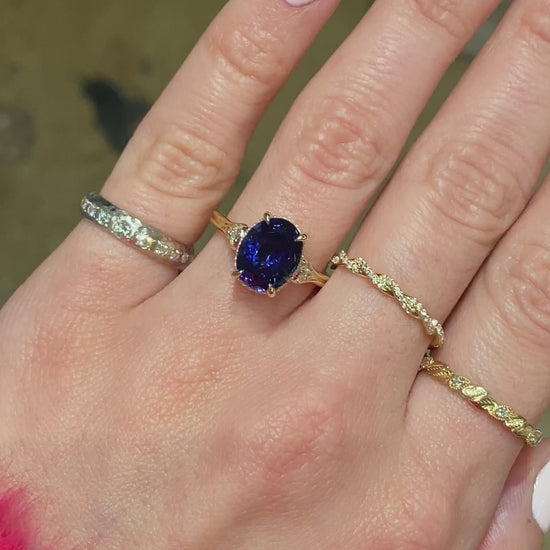 caption:Shown with 3.7ct oval blue sapphire in 14k yellow gold