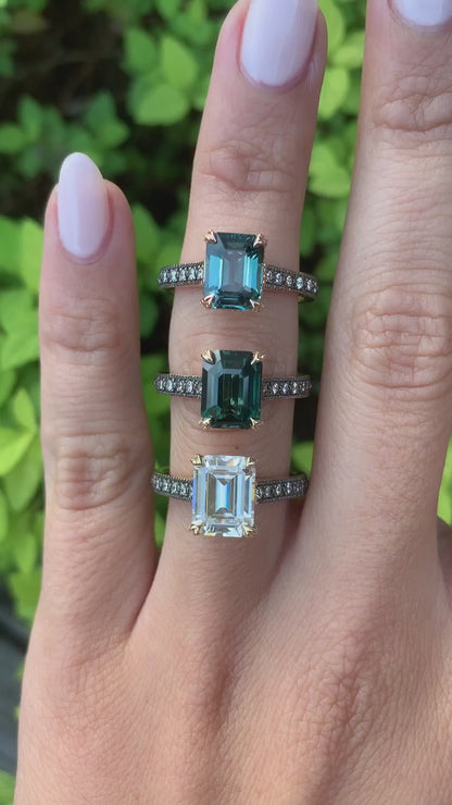 caption:Shown with emerald cut sapphires and diamond center stones