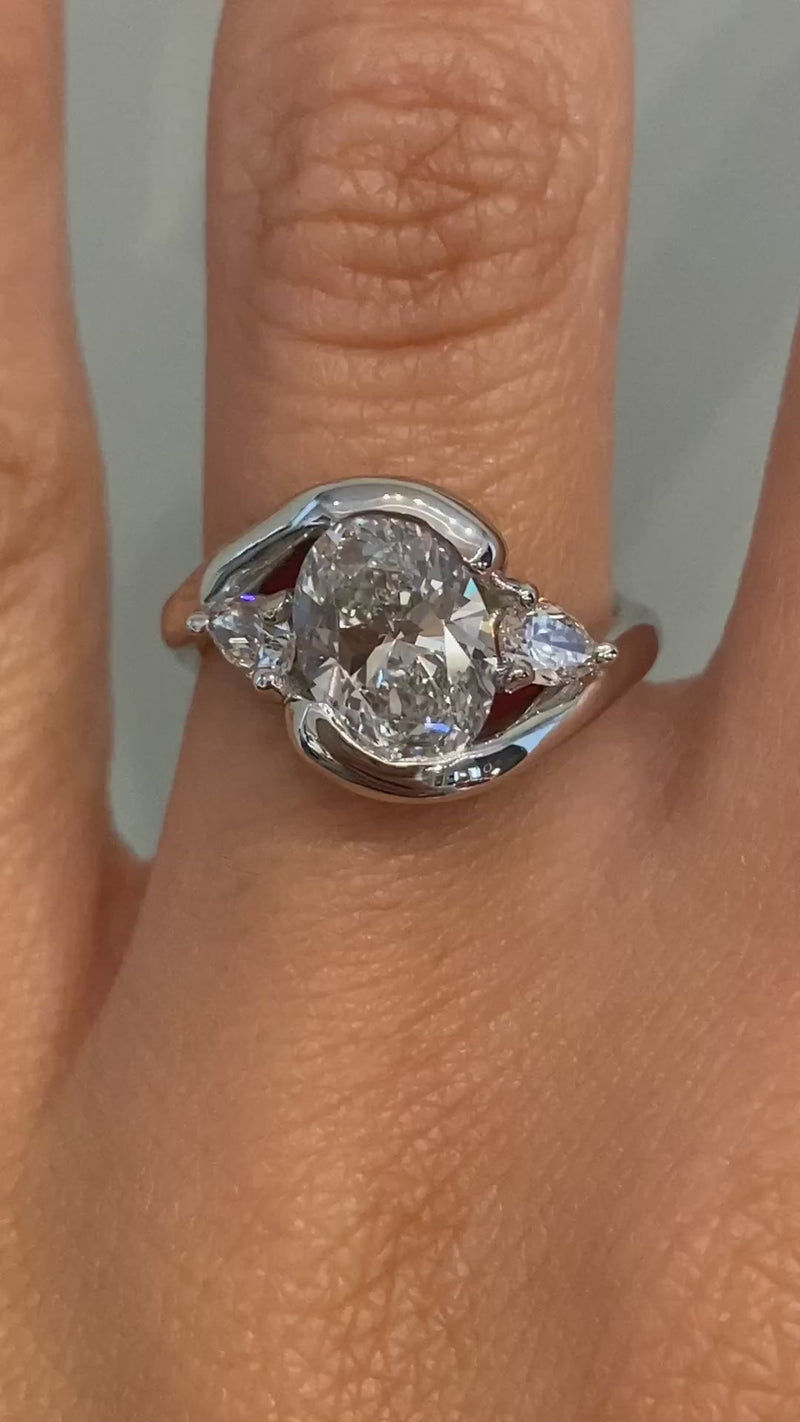 caption:Shown with 1.5ct oval diamond in platinum