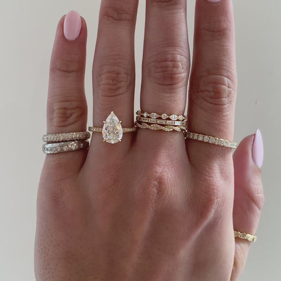 caption:Shown with 2ct pear in 18k yellow gold