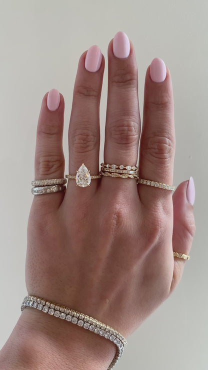caption:Shown with 2ct pear in 18k yellow gold