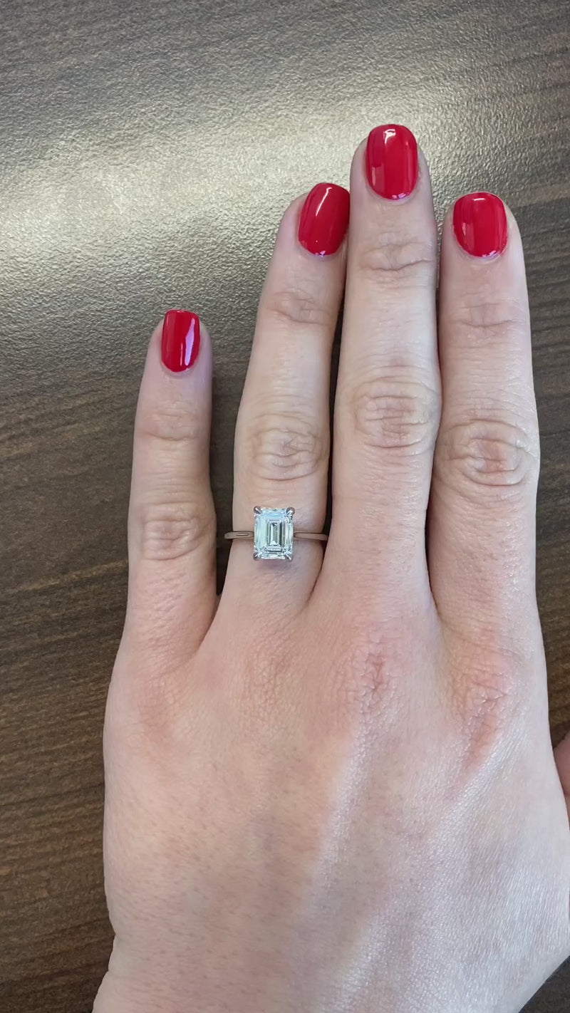 caption:Shown with 2ct emerald cut diamond in platinum