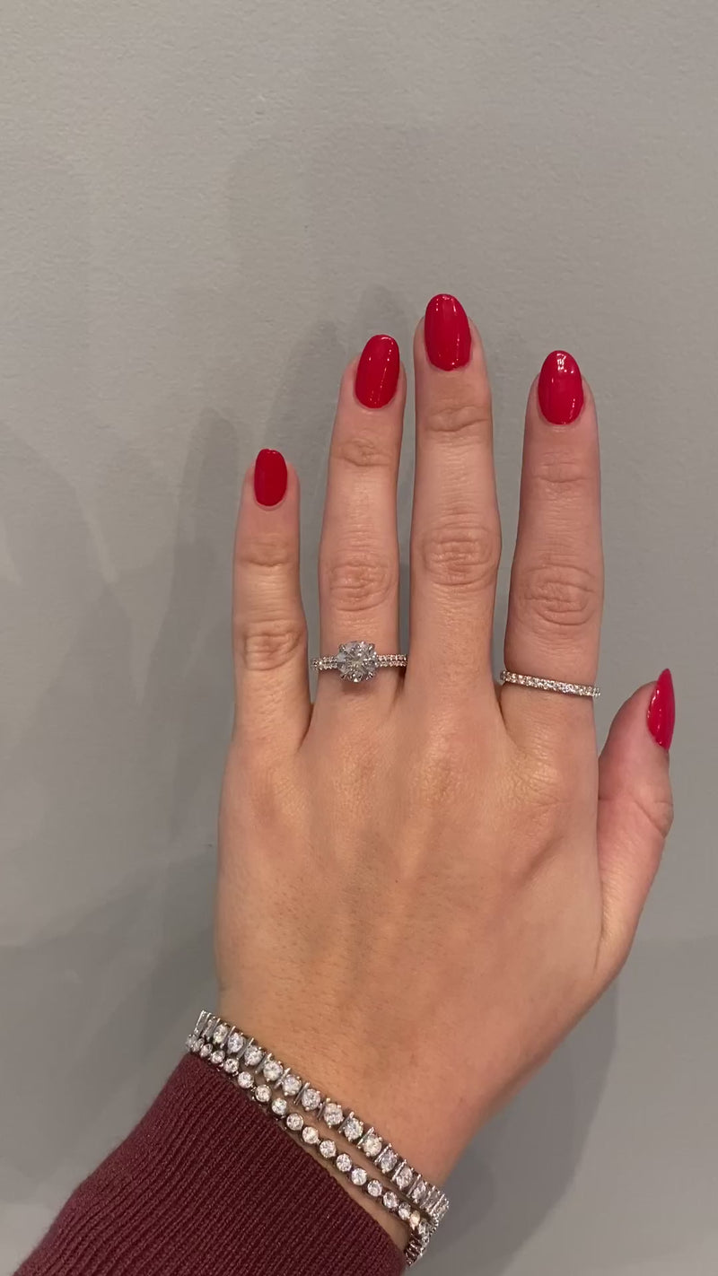 caption:Shown with 2ct round moissanite in platinum
